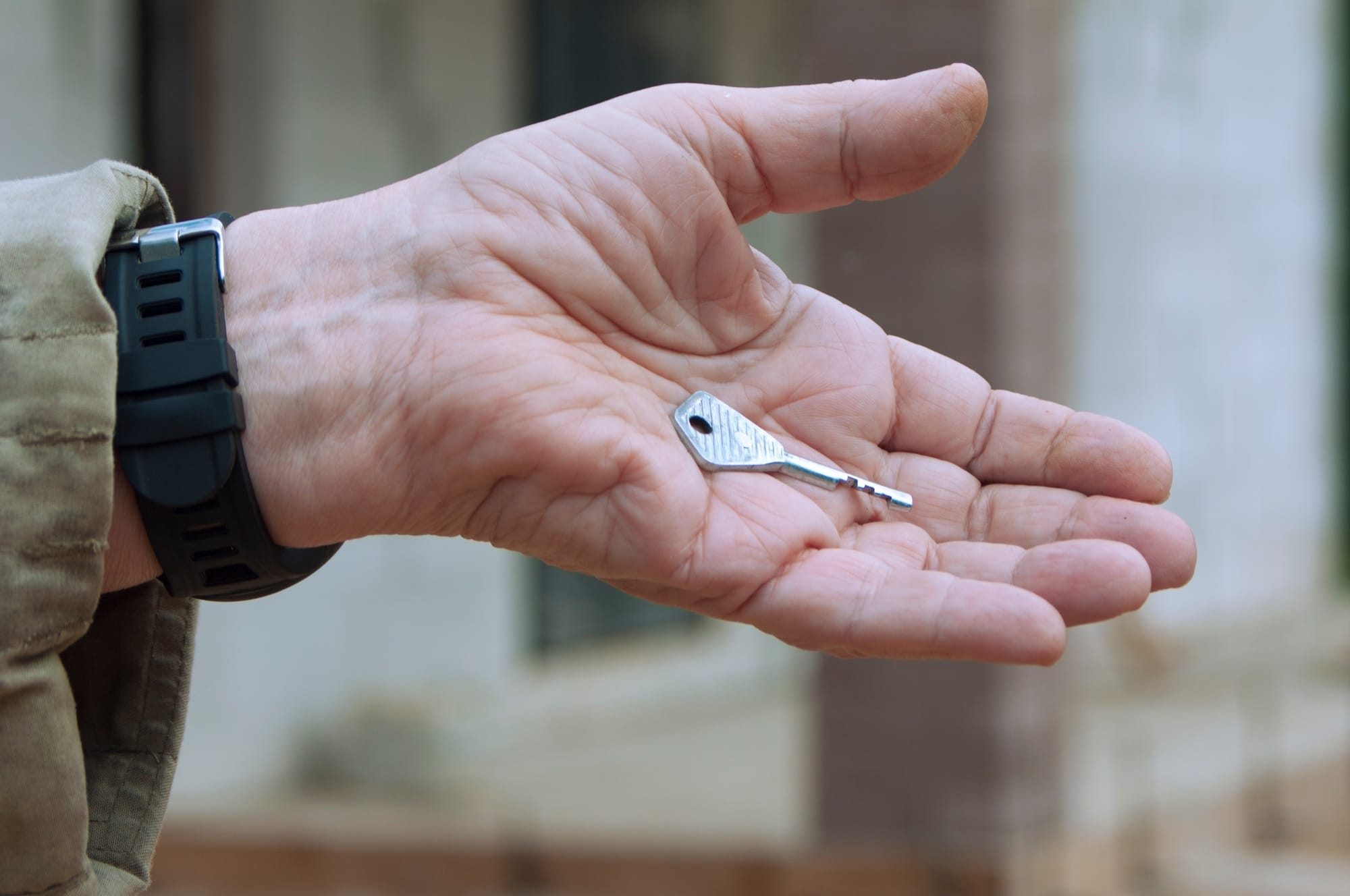 the old man holding the key to the house,